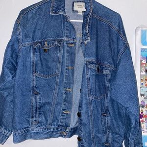 Jean jacket. Durable. The picture is lopsided, but the jacket is even leveled